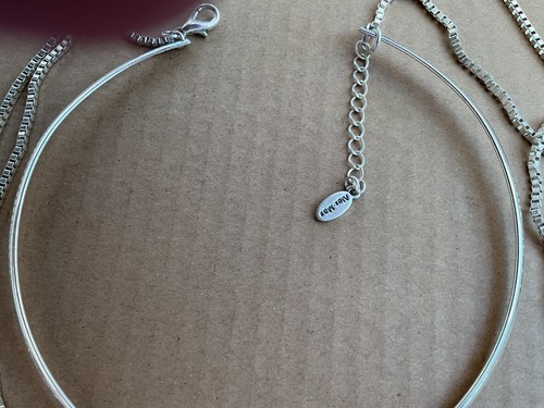 Silver tone torque and chain - and,