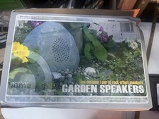 2 outdoor speaker designed to blend in garden or landscape as it resembles Rock