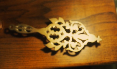 Antique cast brass trivet
