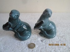 VINTAGE     POOLE POTTERY  SEAL WITH FISH  X  2      see des.