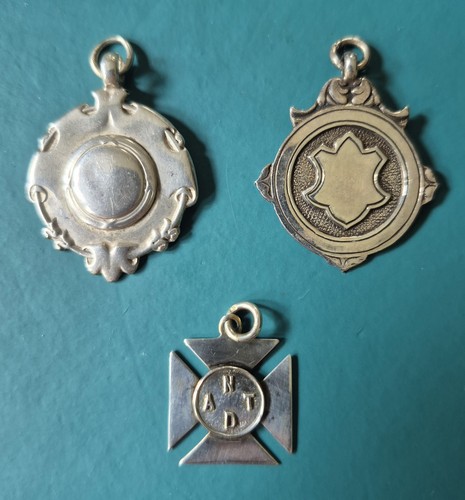 Three silver watch fobs - three,