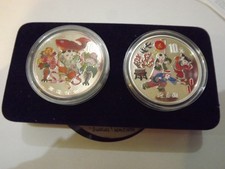 Chinese pure silver coloured coins 2 by 1 ounce each