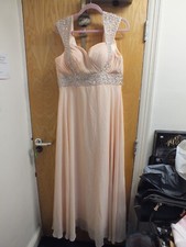 Peach prom or wedding dress size 17 with sequin accents around tummy & bust