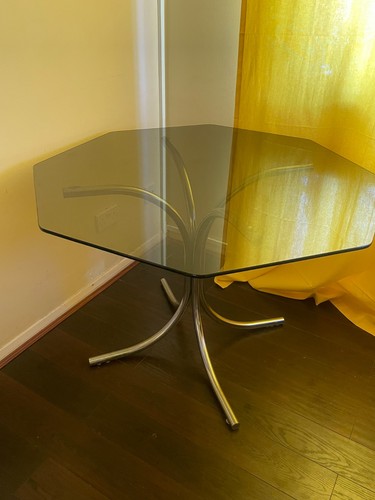 Glass topped dining table