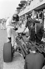 Dan Gurney stands beside his Eagle T1G Weslake the pit lane Italia- Old Photo