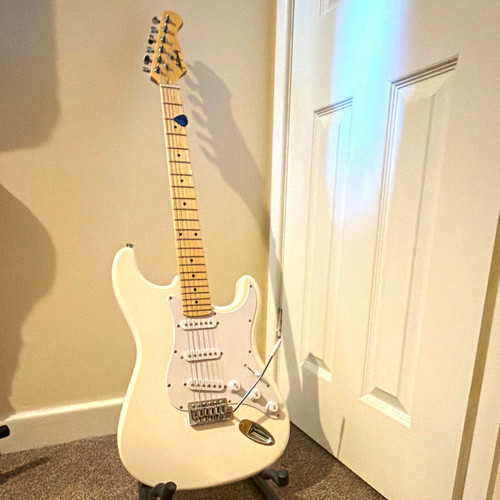 White electric guitar - and, amp