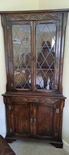 FREESTANDING VINTAGE OAK CORNER  DISPLAY CABINET WITH LEADED GLAZED UPPER DOORS.