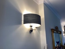 A PAIR OF LAURA ASHLEY SORRENTO WALL LIGHTS. POLISHED NICEL WITH GREY SHADE