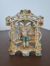 German figure of Boy sitting in an arbour.  Very attractive figure