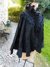 VICTORIAN stunning black silk cape with high ruffled neck and braiding