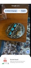 A Sterling Silver Navajo Belt Buckle With turquoise And Red Coral Stones.