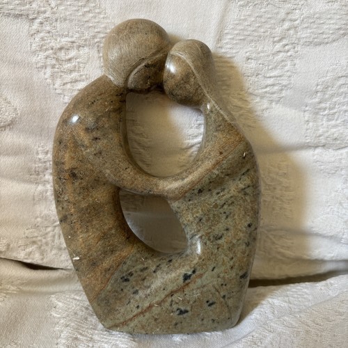 Carved stone man - stone, woman