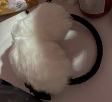 white earmuffs with black bows