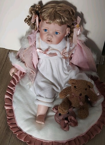 Porcelain baby doll the - by,