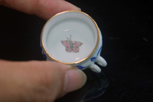 Hand painted porcelain bird - hand,