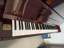 Bechendorfer U110 (German) burgundy upright piano. Full keys (88) and 3 pedals