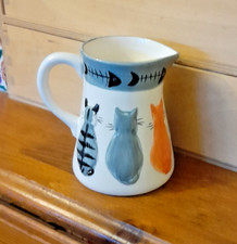 ceramic jug with cats motif