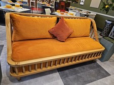 3 Seater Sofa with curved oak frame, with orange cushions circa 1980s