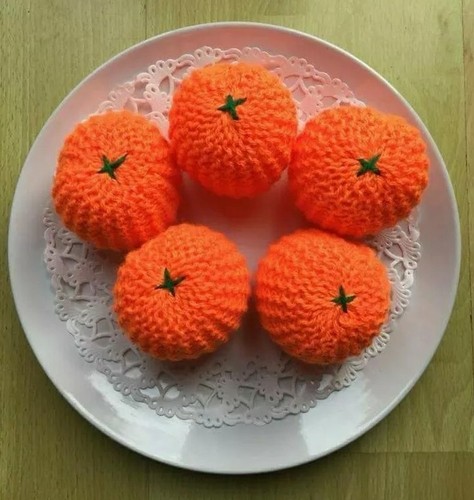 Hand knitted oranges - hand,