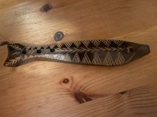 Wood wind instrument in the shape of a fish