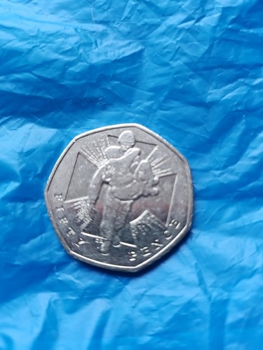 Fifty pence piece showing - piece, judo