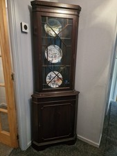 Tall Dark Wood Corner Unit.  Glass Door And Wooden Door.