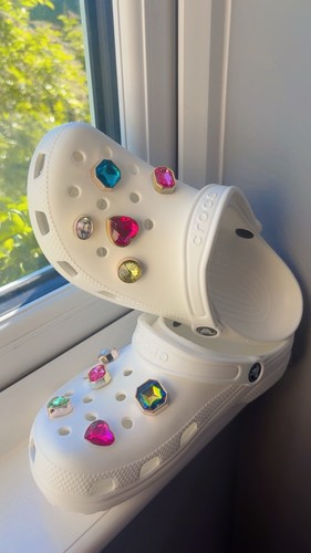 White crocs include gems and - white,