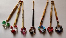 Small group of seven modern hand painted lace bobbins with spangles