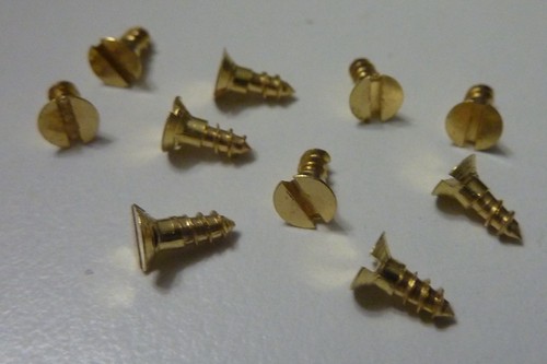 Small tiny brass - /,
