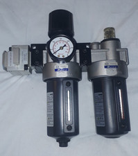 Mindman Air pressure regulator and moisture trap.