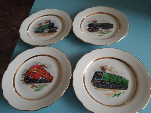 Four fine china side - side, plates