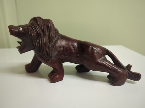 Hand carved lion figurine - carved,