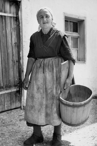 Peasant woman carrying - , a