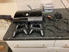 play station 3 with 7 games 4 remotes all tested working