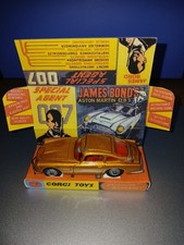 CORGI TOYS. James Bond gold Aston Martin, DB5 261.  With a replica box.