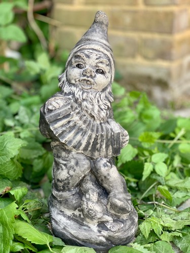 Stone musician figurine