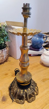 A LARGE SOLID BRASS CANDLESTICK TURNED INTO A LAMP DECORATED STAND
