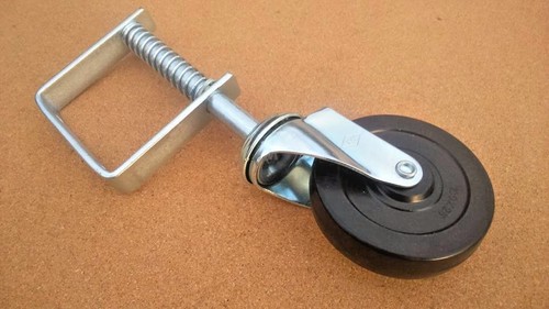 Gate wheel spring loaded