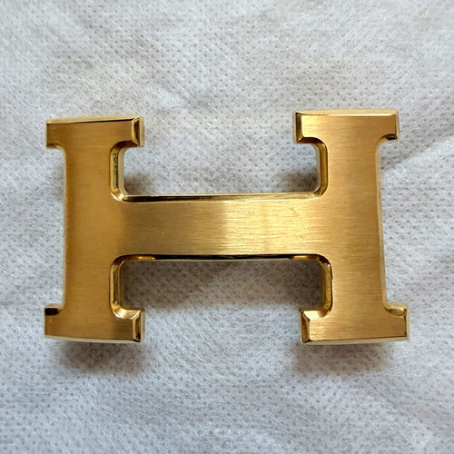 Hermès gold tone logo - h,