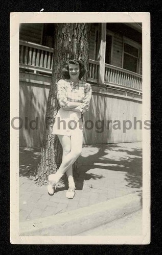Young lady shorts crossed - crossed, legs