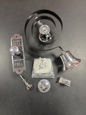 Prima Butlers Bell On Black Spring With Shaped Oblong Enbossed Pull, Chrome.