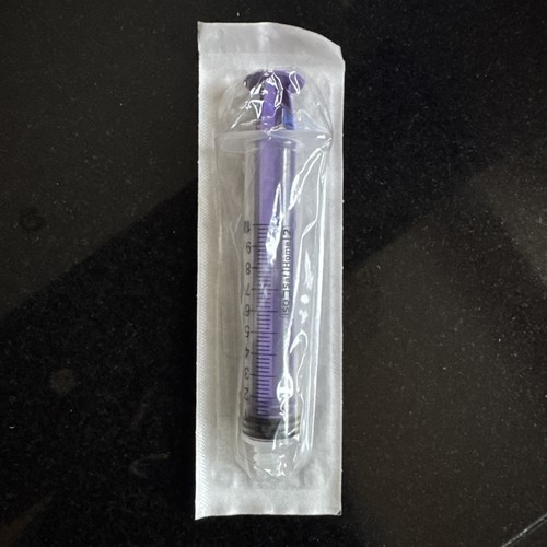 The purple colored syringe - the,