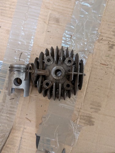Piston and cylinder - and,