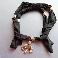 Black Scarf with Silver Tone Rings and Ornamental Elephant Pendant Detail
