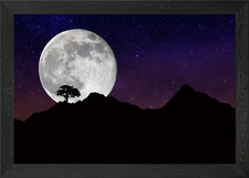 the moon behind the mounta