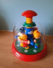 TOLO bright vintage Childs spinning toy