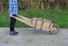 old vintage wooden wheelbarrow