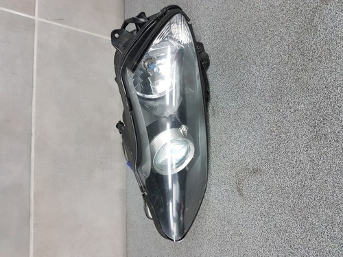 Right headlight broken hook - right,