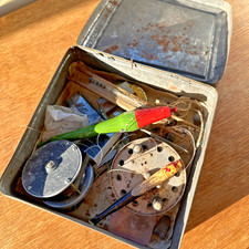 Vintage tin of old fishing