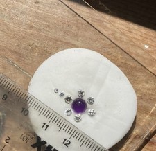 8 Natural Tested RoundStyle Loose Diamonds WeighingIntot. .97 Ct & Amatyst Cab.